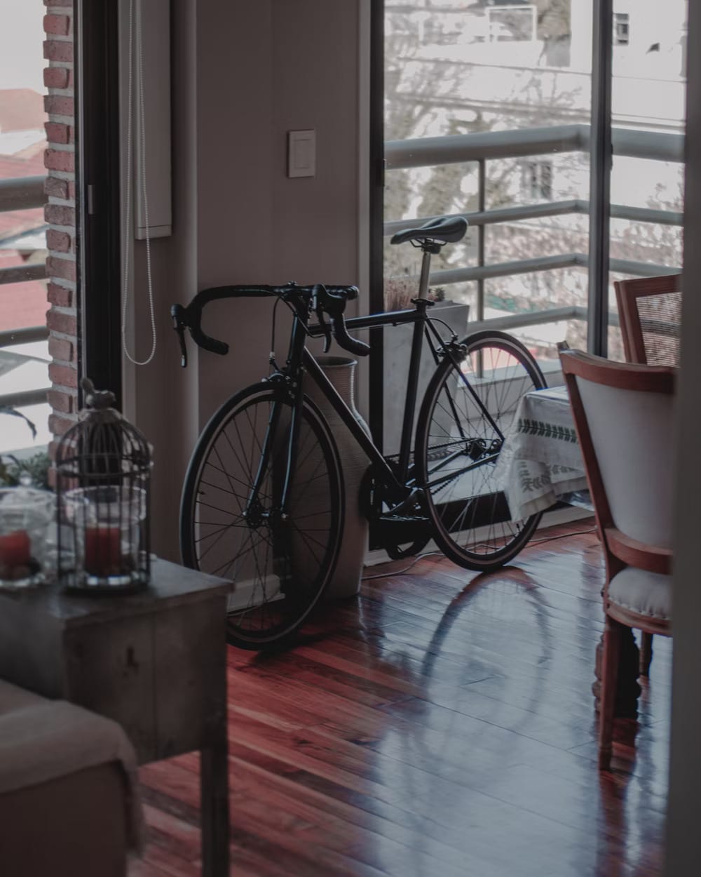 A bicycle parked inside the living room 