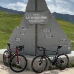 Col de la Madeleine marker with 2 bikes in front