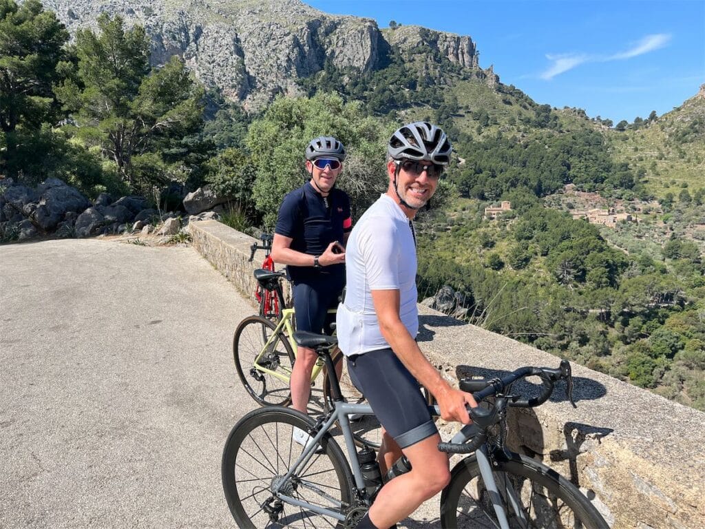 Two happy road cyclists at the top of Puij Major