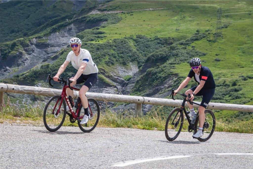 two cyclists nearing the summit of the col de la madeleine