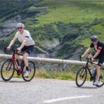 two cyclists nearing the summit of the col de la madeleine