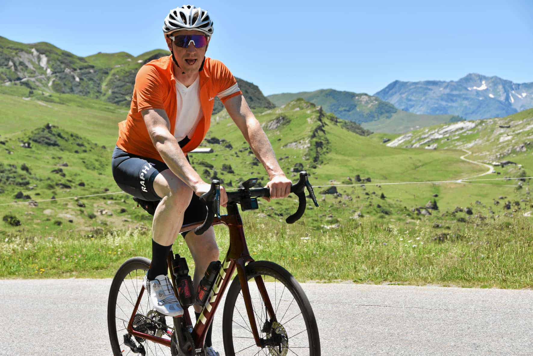 a cyclist riding up cormet de roselend in the alps