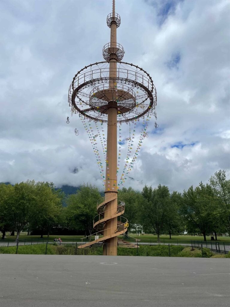 a tower in albertville decorated with bicycles