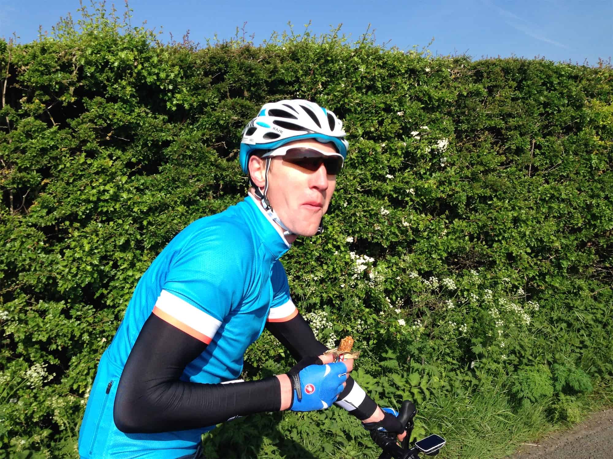 cyclist snacking on energy bar during a ride