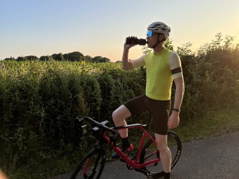 cyclist drinking water during morning ride