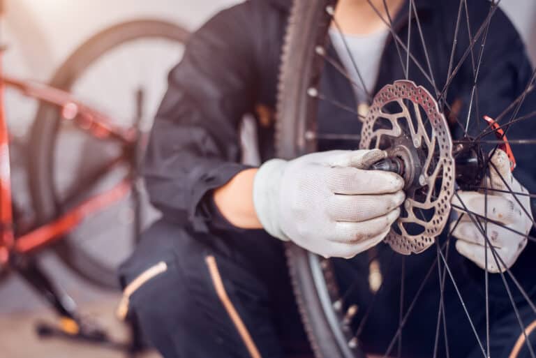 Bicycle maintenance, Rider is assembling the bicycle parts, Clos