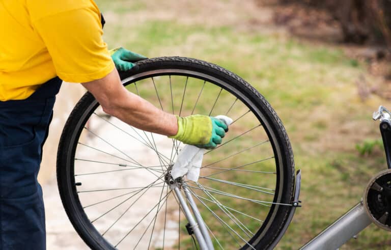 Man cleaning his bicycle for the new season